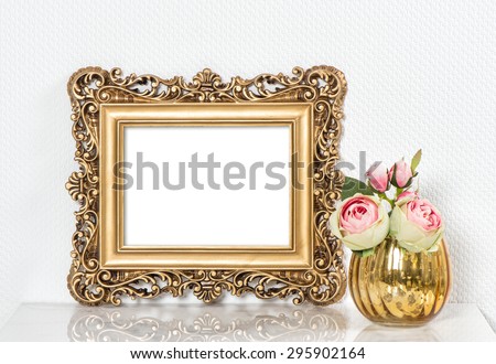 Baroque golden picture frame and rose flowers. Vintage style mockup with space for your picture or text