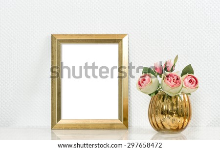 Picture mockup with golden frame and rose flowers. Vintage style objects. Product display