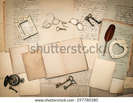 Old letters and photo frames. Vintage things, handwritten documents, open book. Nostalgic sentimental paper background