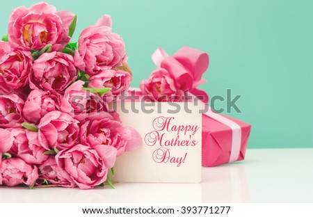 Pink tulips, gift box and greetings card with sample text Happy Mother\'s Day!
