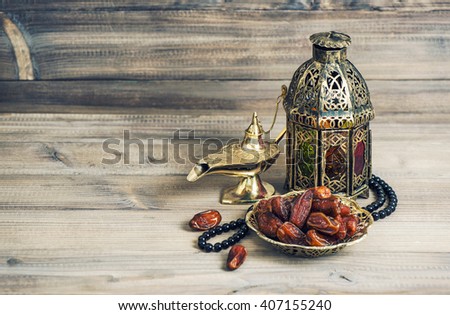 Arabian lantern, golden lamp and fruits. Islamic holidays decoration. Eid mubarak. Vintage style toned picture