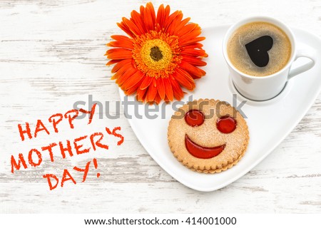 Black coffee with smiled cookie. Heart, love, flower. Happy Mothers Day! Mothers Day breakfast. Mothers Day greetings card. Mothers Day concept. Mother\'s Day. Mothers Day gift
