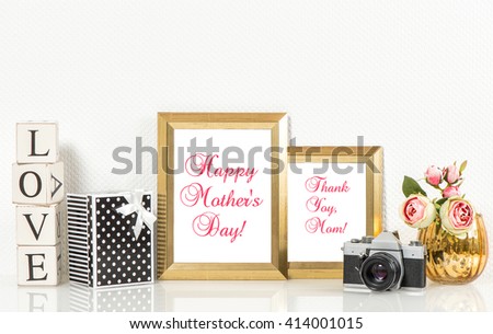 Golden picture frames, roses flowers and no name vintage camera. Copy space for Your designs. Happy Mothers Day! Mothers Day greetings card. Mothers Day concept. Mother\'s Day. Mothers Day gift