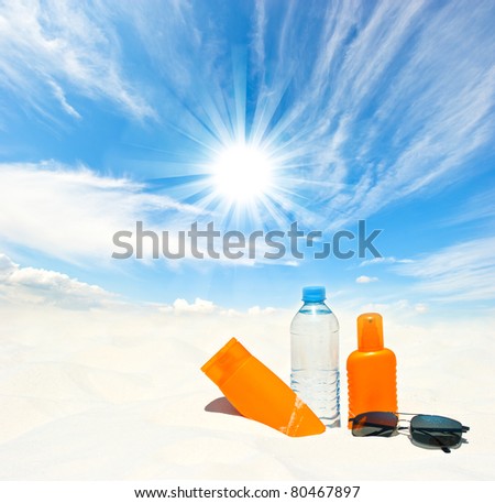 water and sun protection cream on sky background