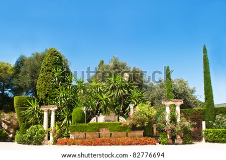 lash tropical plants against blue sky. Villa Ephrussi de Rothschild, Cap Ferrat, France