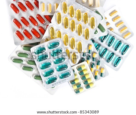 colorful  pills and capsules. assorted medicament on white