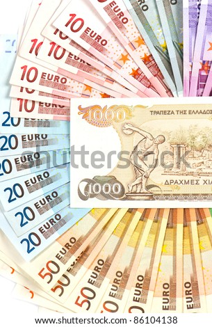 old greek drachma (its no existing money) and euro cash notes. euro crisis concept