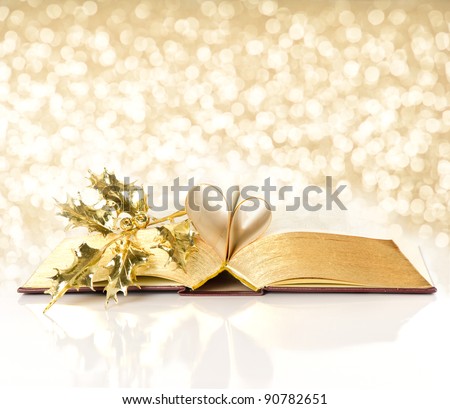 open vintage book with golden pages. bible with golden decoration. shiny lights background