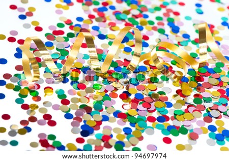 colorful confetti background with golden streamer on white background