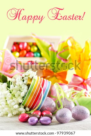Happy Easter! card concept. colorful easter decoration. chocolate eggs and flowers