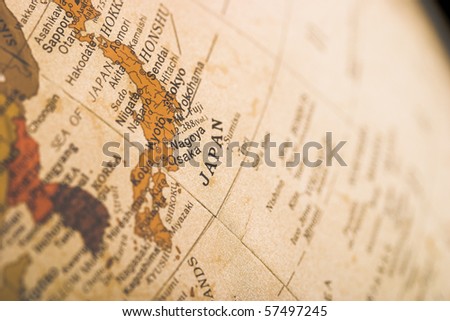 A close up of japan with shallow depth of field on an off white colored globe.