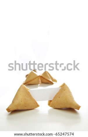 Asian fortune cookies with blank paper isolated on white background.