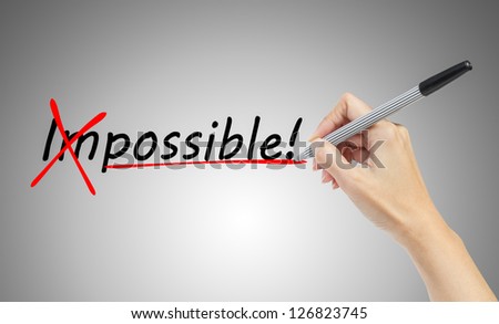 hand drawing and  changing the word impossible to possible, business concept