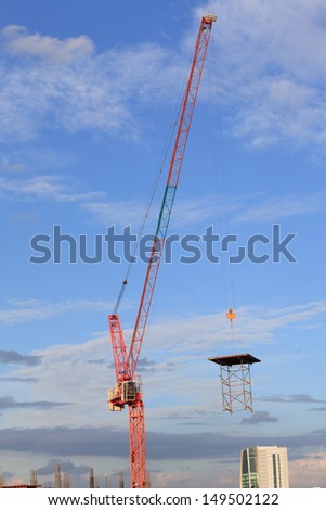 Construction site with crane worker and building