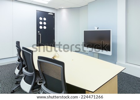 teleconferencing, video conference and telepresence business meeting room with display screen