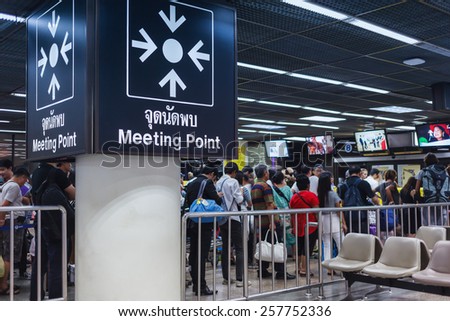 BANGKOK THAILAND - FEBRUARY 17 : The meeting point sign and business crowd or people waiting queue for transportation or taxi at Donmueang International Airport Bangkok, Thailand on February 17, 2015