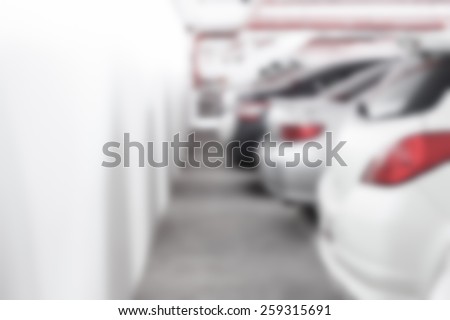 Abstract blur background of The back of car at the parking lot with wall space, shallow depth of focus