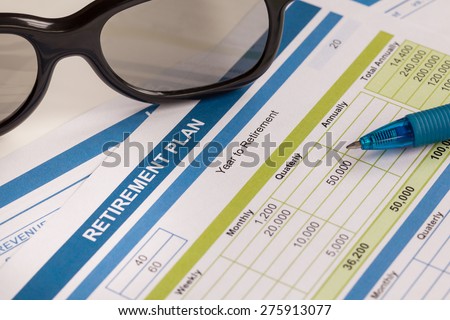 Retirement Planning with glasses and pen, business concept
