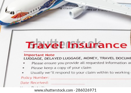 Travel Insurance Claim application form on brown envelope, business insurance and risk concept; document and plane is mock-up