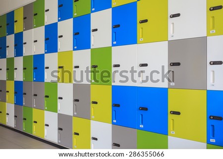 row of colorful lockers and security password code on door for safety concept