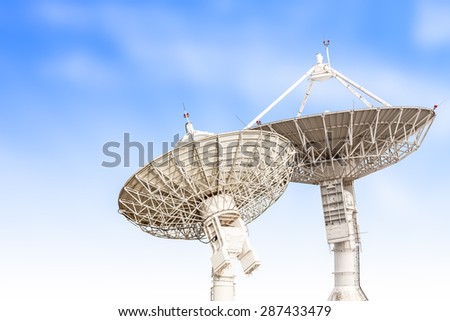 satellite dish antenna radar big size isolated on blue sky background
