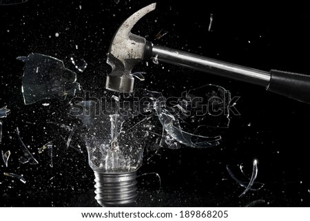 smashing a light bulb with a hammer