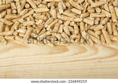 wood pellets on wood with copy space