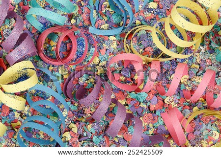 colorful party streamers on confetti