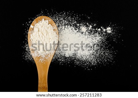 small amount flour on black background