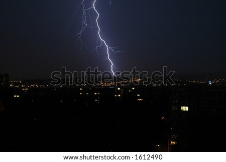 Thunderstorm and lightning over the city in night