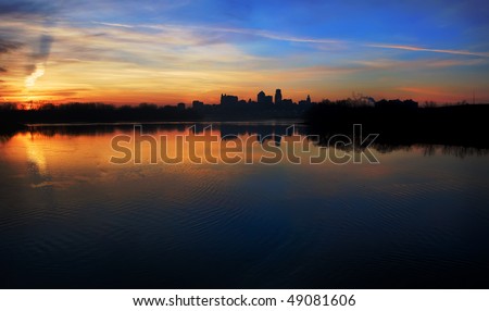 A silhouetted panoramic view of the Kansas City skyline which is located in the Great Plains area in the United States.
