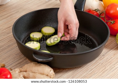Zucchini in the pan, ready for cooking