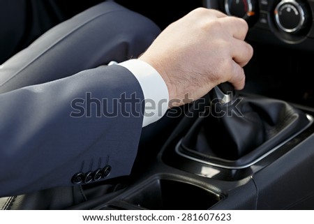 Hand of the driver of the car