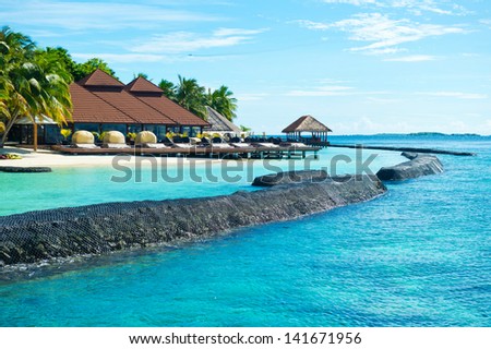 Scenic view on tropical island with turquoise water and blue sky