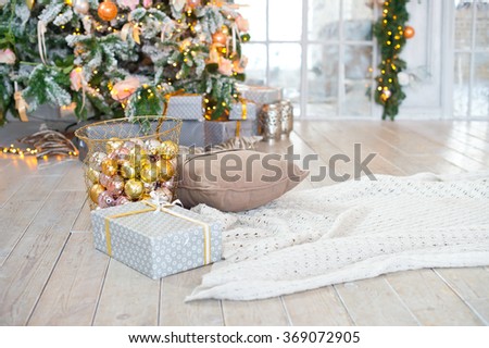 Bright living room decorated with christmas tree and presents for new year party celebration. Indoor interior.