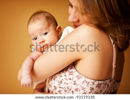Beautiful mother holds her newborn baby