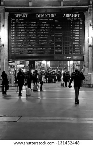 PARIS - FEB. 20: Passengers make their way through Gare Du Nord on the morning of Feb. 20, 2013. Gare du Nord is the station for trains to Northern France, Belgium, Germany, Netherlands, and the UK.