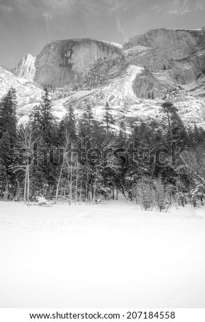 Half Dome in Yosemite National Park, as seen from a frozen Mirror Lake.  In black and white.