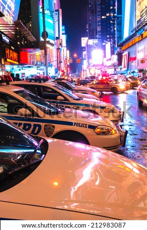 NEW YORK CITY - JULY 26:  Times Square, lined with NYPD police cars on July 26, 2011 in Manhattan, New York City.  New York Police Department has a station in Times Square.