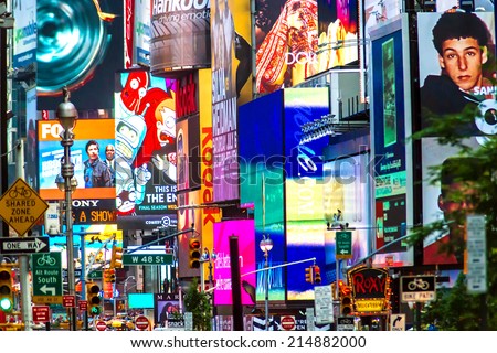 NEW YORK - JUNE 23: Collage of neon lights, street signs and advertisements at Times Square in New York City on June 23, 2013. Times Square holds the annual New Year\'s Eve ball drop.