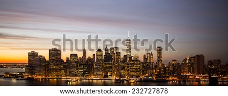 Panorama of Downtown Manhattan skyline and the East River at sunset,