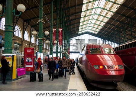 PARIS- FEB 13:  Travelers disembarking at Gare du Nord Train Station in Paris, France on February 13, 2013. Gare du Nord is Paris\' busiest commuter station.