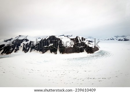Aerial view of Norris Glacier in Alaska on a cloudy day