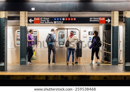 NEW YORK, NEW YORK - JUNE 28, 2013: MTA subway train station platform with people traveling in New York on June 28, 2013. The NYC subway system is one of the oldest in the USA.