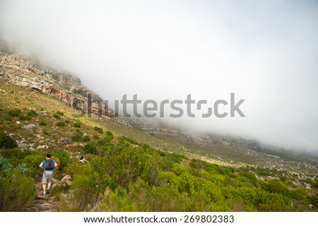 Hikers climbing Table Mountain via Platteklip Gorge.  Table Mountain is a new Seven Wonder of the Natural World located in Cape Town, South Africa.