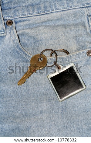 Denim pocket with a key tag hanging out - Can add text to the key tag