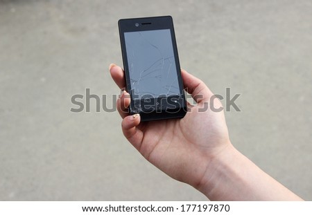 Cracked phone in hand