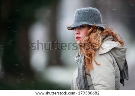 Portrait of Young Woman Outside While It\'s Snowing