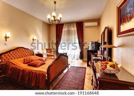 Belgrade, Serbia - March 24, 2012: The interior of a luxurious hotel room, with king bed.