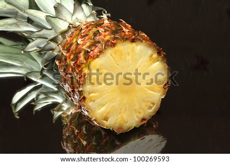 Fresh slice pineapple on black background